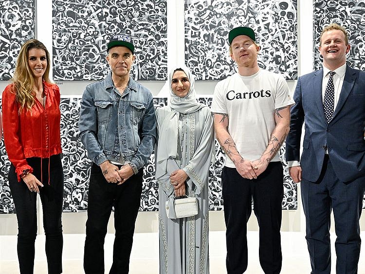 Robbie Williams (second left) and Ed Godrich (second right).