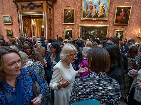 Britain's Camilla, the Queen Consort, centre, attends a reception to raise awareness of violence against women and girls as part of the UN 16 days of Activism against Gender-Based Violence, in Buckingham Palace, in London, Tuesday Nov. 29, 2022.
