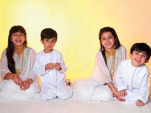 The joy of children at Hajar's house when they wear authentic traditional clothes on UAE National Day. 