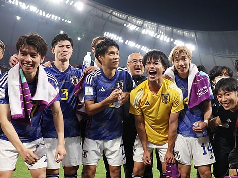 Japan team players and staff celebrate after beating Spain 2-1 in the FIFA World Cup 2022, at Khalifa International Stadium, in Al Rayyan.
