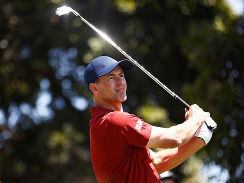 Adam Scott shot a course-record-equalling 63 on day two