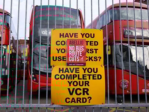 A sign reading 'Abellio No Bus Rout Cuts' on a picket line, during a strike by bus drivers employed by Abellio Transport Group Ltd., outside the Walworth Depot bus garage in London, UK, on Friday, Dec. 2, 2022.  