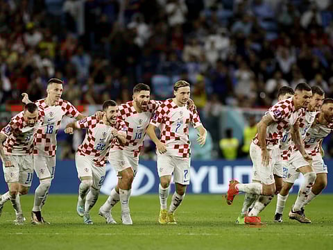 Croatia players celebrate after the penalty shootout win against Japan at the Al Janoub Stadium, Al Wakrah, Qatar to progress to the quarter finals.