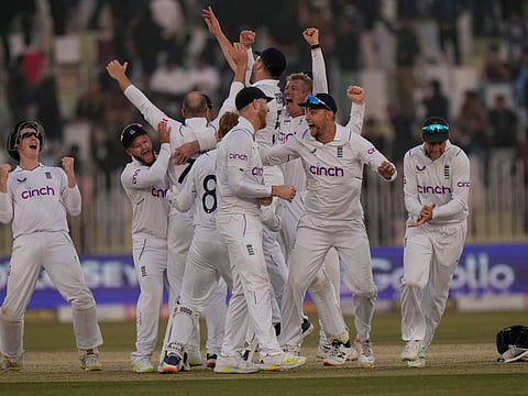 England's players celebrate after winning the Test match against Pakistan, in Rawalpindi, Pakistan.
