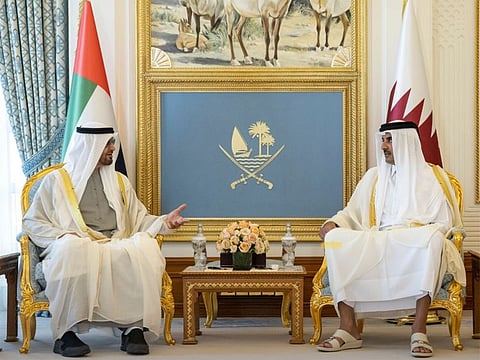 President His Highness Sheikh Mohamed bin Zayed Al Nahyan with Sheikh Tamim bin Hamad Al-Thani, Emir of Qatar, during their meeting in Doha on Monday.