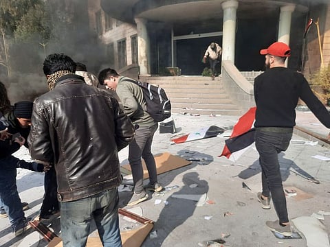 People gather as they take part in a protest in Sweida, Syria, December 4, 2022, in this picture obtained by Reuters.  
