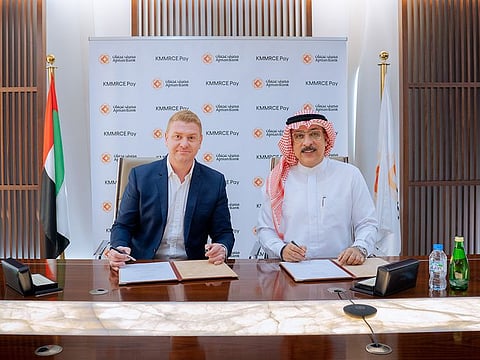 Ajman Bank CEO Mohamed Amiri at the signing ceremony with Justin Henry, Executive Director at KMMRCE Pay