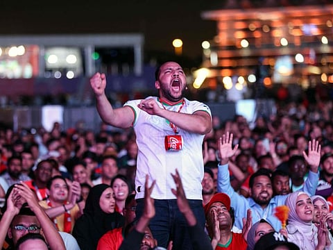 Morocco's supporters celebrate after their team won the Qatar 2022 World Cup round 16 football match between Morocco and Spain, at the FIFA fan zone in Doha, on December 6, 2022. Picture used for illustrative purposes. 