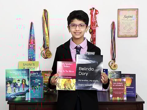 Sajini with some of the books that she has published