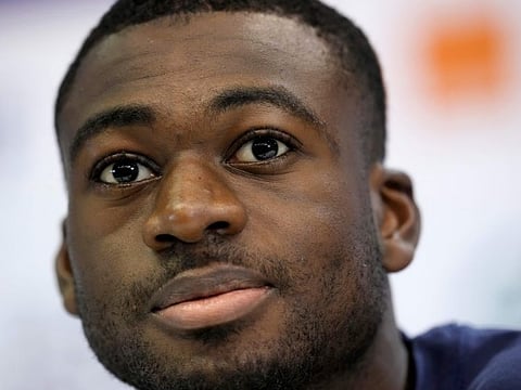 France's Youssouf Fofana answers questions during a press conference at the Jassim Bin Hamad stadium in Doha.