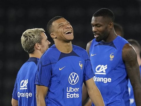 France's Antoine Griezmann (left), Kylian Mbappe (centre) and Marcus Thuram during a training session at the Jassim Bin Hamad stadium in Doha.