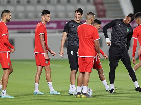 Morocco's goalkeeper Yassine Bounou (centre) and his teammates take part in a training session at the Al Duhail SC Stadium in Doha on Friday.