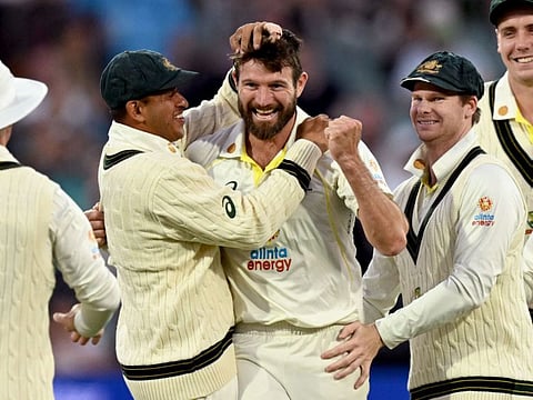 Australian bowler Michael Neser (centre) celebrates with teammates after dismissing West Indies' Kraigg Brathwaite during the second day of the second Test in Adelaide.