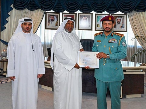 Omar Hassan Shuhail Al Qahtani receives a certificate from Major General Saif Al Ziri Al Shamsi, Commander-in-Chief of Sharjah Police