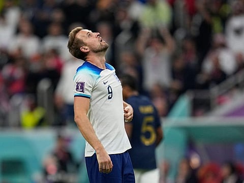 England's Harry Kane react after missing a penalty against France during the World Cup quarterfinal at the Al Bayt Stadium in Al Khor, Qatar.