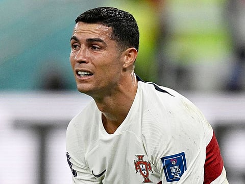 Portugal's Cristiano Ronaldo reacts after his team lost the Qatar World Cup quarter-final match against Morocco at the Al Thumama Stadium in Doha on December 10, 2022. 