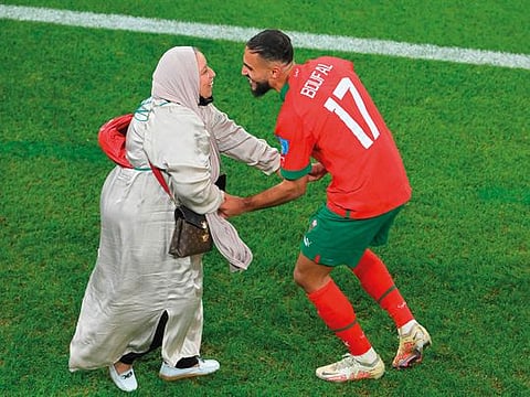 Morocco’s Sofiane Boufal celebrates with his mother after defeating Portugal in the FIFA World Cup Qatar 2022 quarterfinal football match at the Al Thumama Stadium in Doha on December 10, 2022. The win made Morocco the first Arab and African nation to enter the World Cup semifinals. 