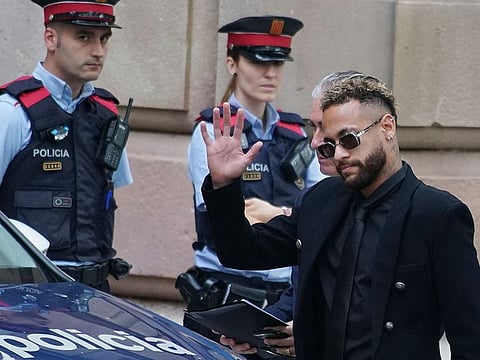 Former FC Barcelona player Neymar waves on arrival at a court in Barcelona in October this year.