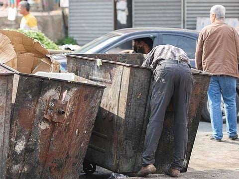 A man searches through a garbage bin in Sidon, Lebanon.  Unicef said the Middle East and North Africa, including Iraq, Lebanon, Sudan, Libya, Jordan and the Palestinian territories, account for 25 per cent of the global funding it is seeking from donors for next year.