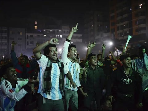 Bangladeshi fans of Argentina cheer as they watch on a big screen in Dhaka, the World Cup semi final match between Argentina and Croatia in Qatar, on Wednesday. 