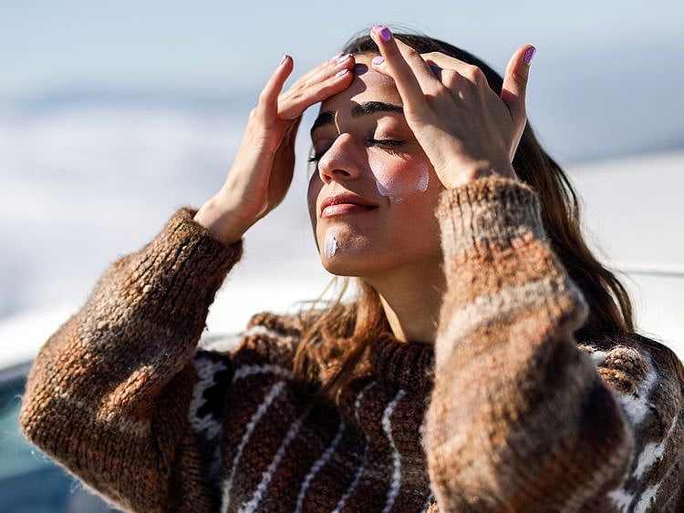 Woman touching her face 