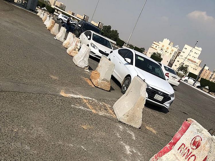 Concrete barriers block a road leading to the market in Jeddah.