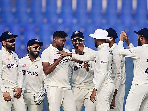 India's Mohammed Siraj (3rd L) celebrates with his teammates after the dismissal of the Bangladesh’s Litton Das during the second day of the first Test match at the Zahur Ahmed Chowdhury Stadium in Chittagong on December 15, 2022. 