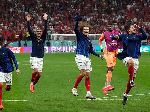 France's Antoine Griezmann celebrates with teammates after the World Cup semi-final win over Morocco at Al Bayt Stadium in Al Khor.
