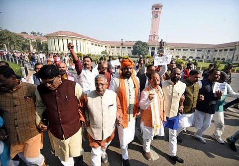 Leader of Opposition in Bihar Legislative Assembly Vijay Kumar Sinha and BJP leaders stage a Raj Bhawan march to protest over the Bihar hooch tragedy during the Winter Session of the State Assembly in Patna on Friday.  