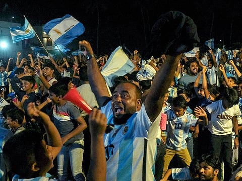  Fans of Argentina cheer as they watch the FIFA World Cup Qatar 2022 final match against France on a big screen at the Kothi football ground, in Kozhikode on Sunday.