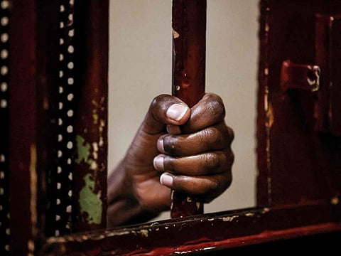 An inmate's hand is seen as she grabs at her cell's iron bars in a prison in Lebanon. Picture used for illustrative purpose only.