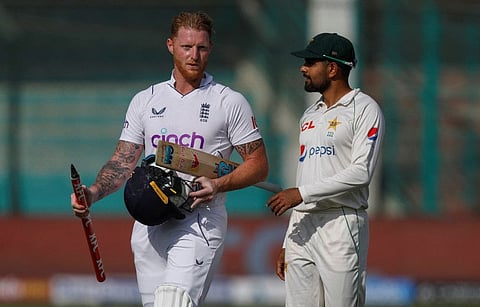 England's captain Ben Stokes talks to his Pakistani counterpart Babar Azam after winning the third Test in Karachi on Tuesday.