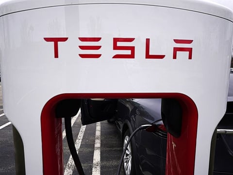 FILE - Tesla Supercharger is seen at Willow Festival shopping plaza parking lot in Northbrook, Ill., on May 5, 2022. New electric vehicle models from multiple automakers are starting to chip away at Tesla's dominance of the U.S. EV market, according to national vehicle registration data. (AP Photo/Nam Y. Huh, File)
