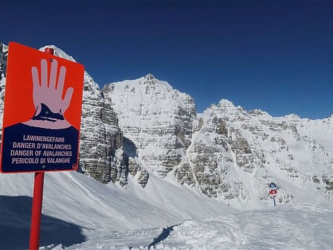 An avalanche warning sign is seen next to the slope at Schlick 2000 ski resort near Neustift im Stubaital, Austria 