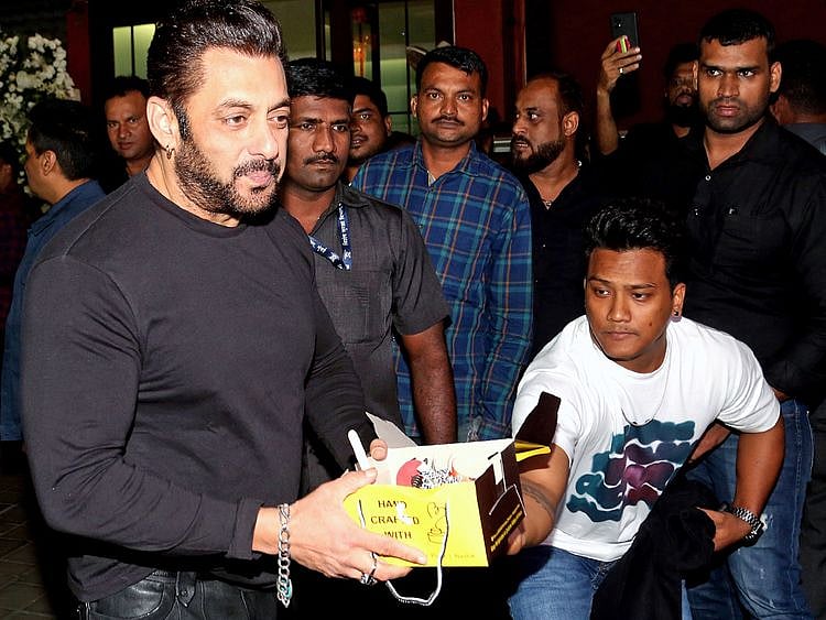 Bollywood actor Salman Khan holds a cake during his 57th birthday party celebration hosted by his sister Arpita Khan Sharma, at her residence, in Mumbai on Monday. 
