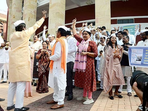 Nationalist Congress Party (NCP) MLAs stage a demonstration (Bhajan Andolan) against the Maharashtra Government outside Vidhan Bhavan during the Winter Session of the State Assembly, in Nagpur on Tuesday, Dec 27, 2022. 