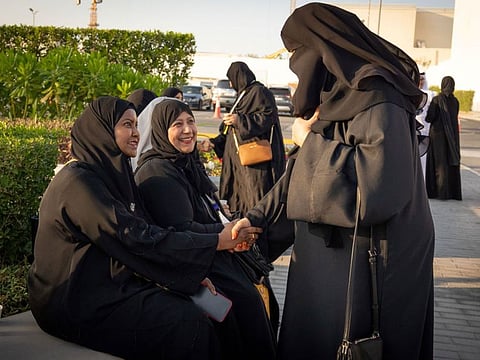 Volunteers and senior citizens socialised during a walk and boat tour in Yas Bay