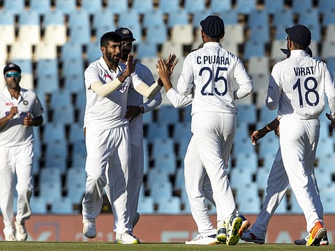 Indian pacer Jasprit Bumrah (left) celebrates with teammates after dismissing South Africa's Rassie van der Dussen during the fourth day of the first Test at Centurion on Wednesday.