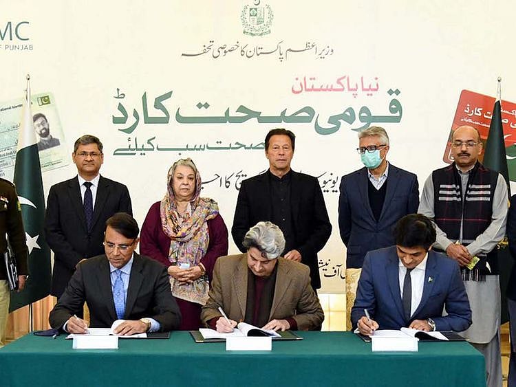 Imran Khan witnesses the signing ceremony for universal health coverage in Islamabad on December 29, 2021. 