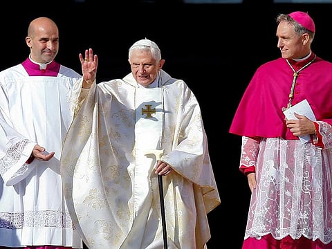 File photo: Emeritus Pope Benedict XVI waves as he arrives to attend a mass for the beatification of former pope Paul VI in St. Peter's square at the Vatican October 19, 2014. 