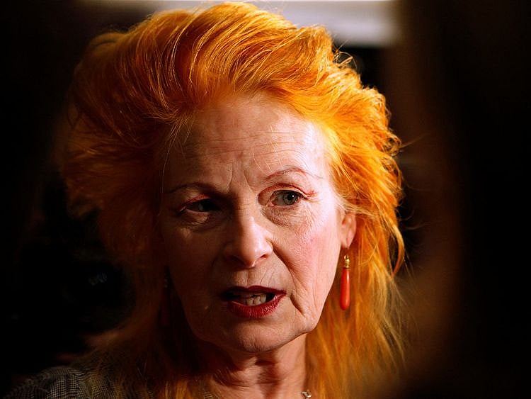 Fashion designer Vivienne Westwood talks to a journalist before the presentation of her 2011 Spring/Summer collection at the London Fashion Week September 19, 2010.