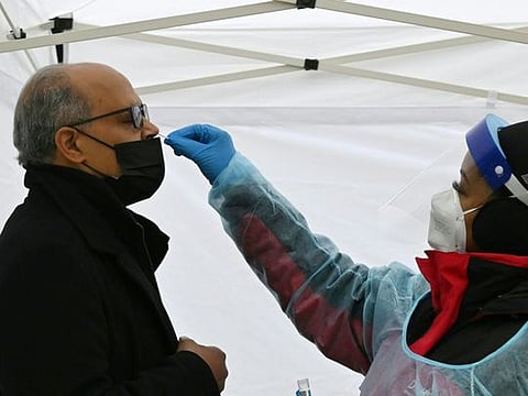 A man gets tested for Covid-19 at a testing site in Washington, DC, on December 29, 2021.  