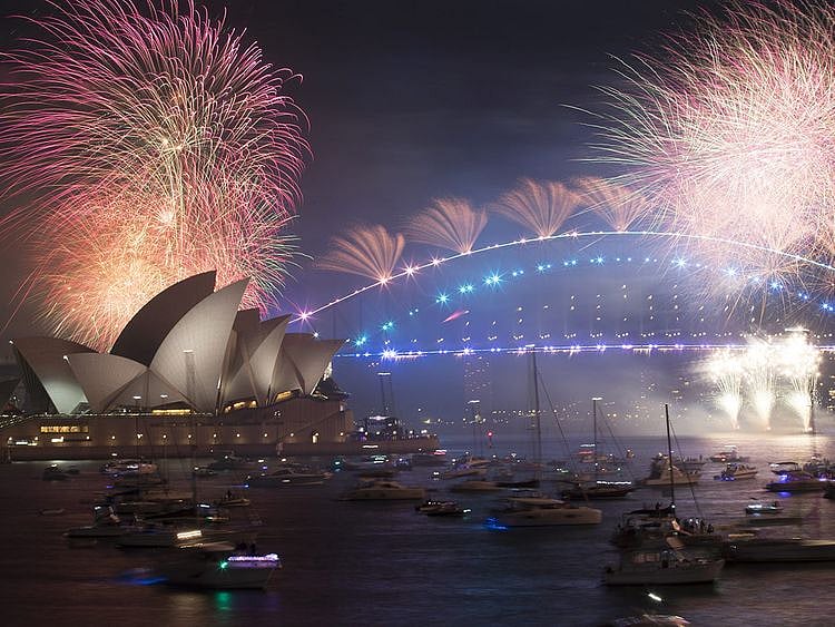 Fireworks by the Sydney Opera House and Sydney Harbour Bridge during New Year celebrations in Sydney, Australia, early on Saturday, January 1, 2022.  