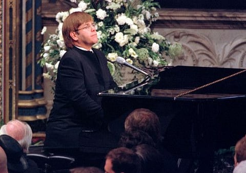 Pop singer Elton John plays a specially re-written version of his classic Candle in the Wind during the funeral service for Diana, Princess of Wales at Westminster Abbey September 6.