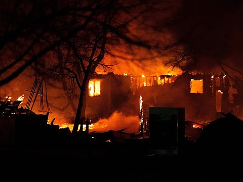 The Marshall Fire engulfs a home in Louisville, Colorado on December 30, 2021 as crews worked through the night battling the blaze that had destroyed more than 500 homes in Boulder County. 