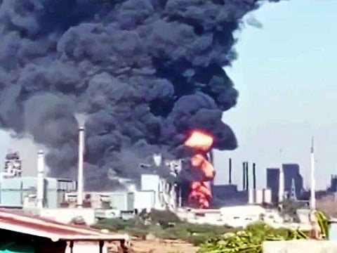 Flames and smoke billow out after a fire broke out in a factory located in Mundegaon village of Igatpuri tehsil, in Nashik on Sunday. 