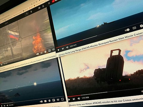 A computer screen with four YouTube windows displaying combat clips from Arma 3's war-themed video games.
