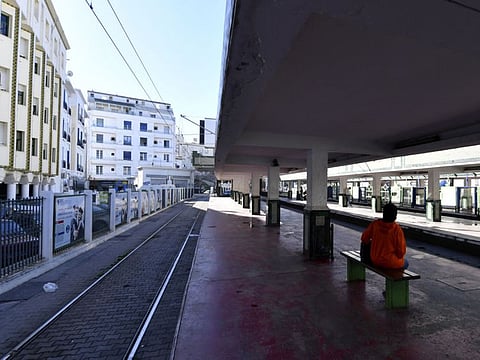 Tunisians are pictured next to a tram station in the capital Tunis, on January 2, 2023, after a strike by the public transport employees was announced the night before.