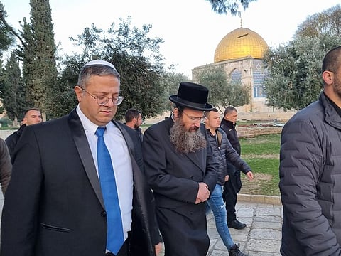 Israeli minister Itamar Ben-Gvir walks past the Dome of the Rock at Haram Al Sharif, which also houses Al Aqsa Mosque, in Jerusalem. 