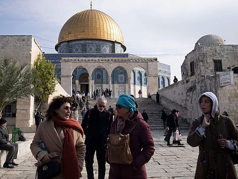 Visitors tour the Al Aqsa Mosque compound in the Old City of Jerusalem on January 3, 2023.  